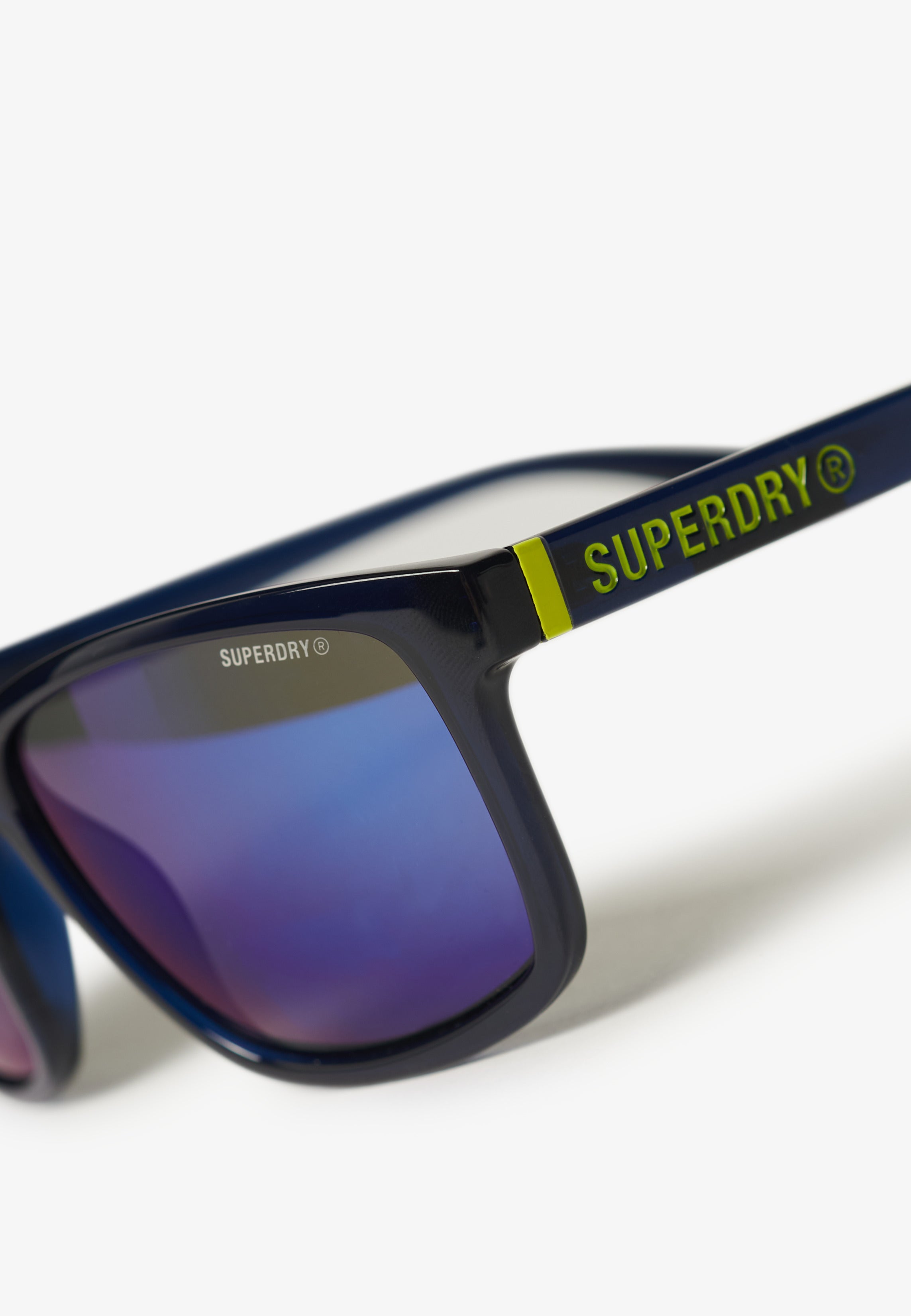Superdry sunglasses with blue reflective lenses on a white background